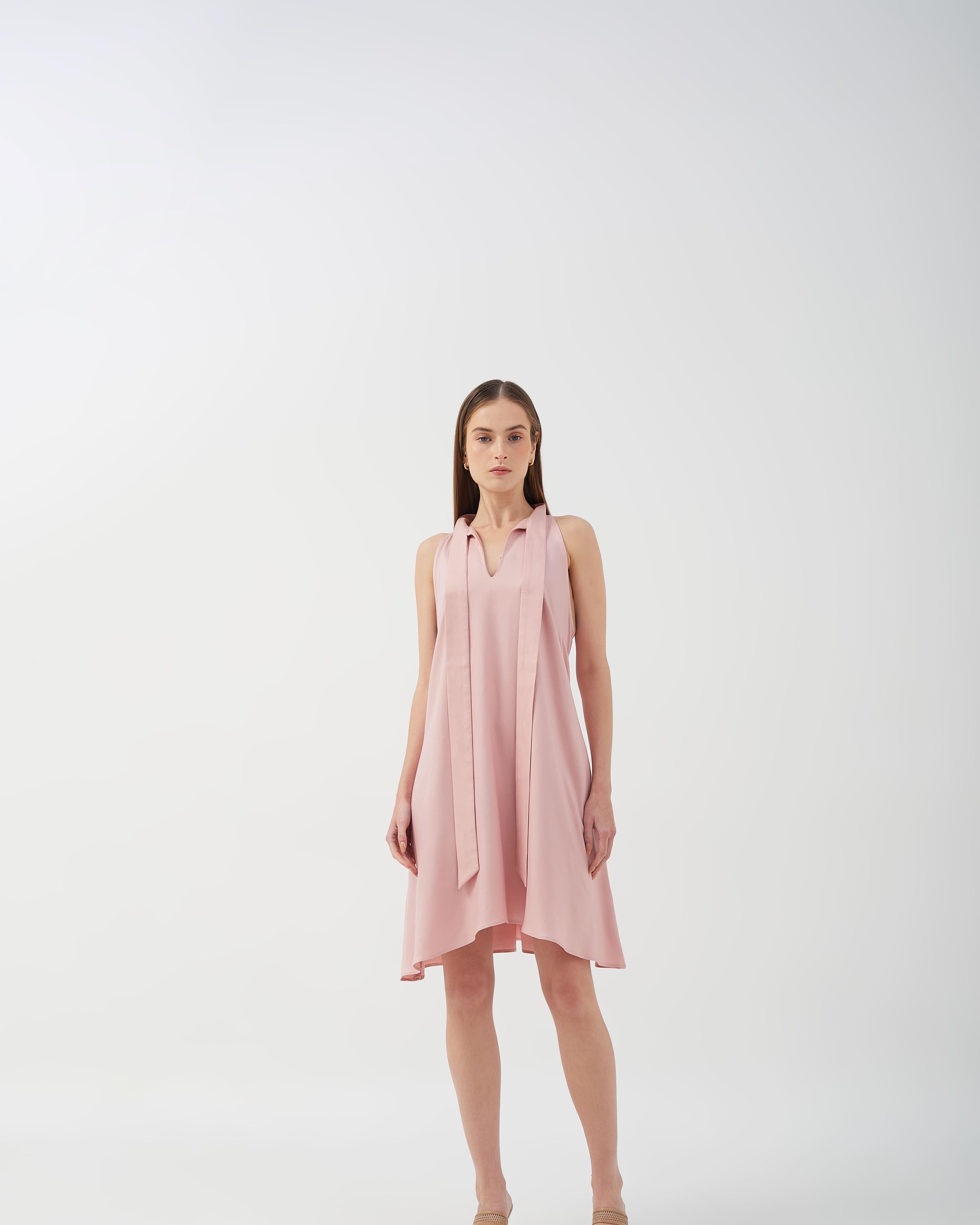 A-line dress with bow tie neck and asymmetrical hem, perfect for casual styling.