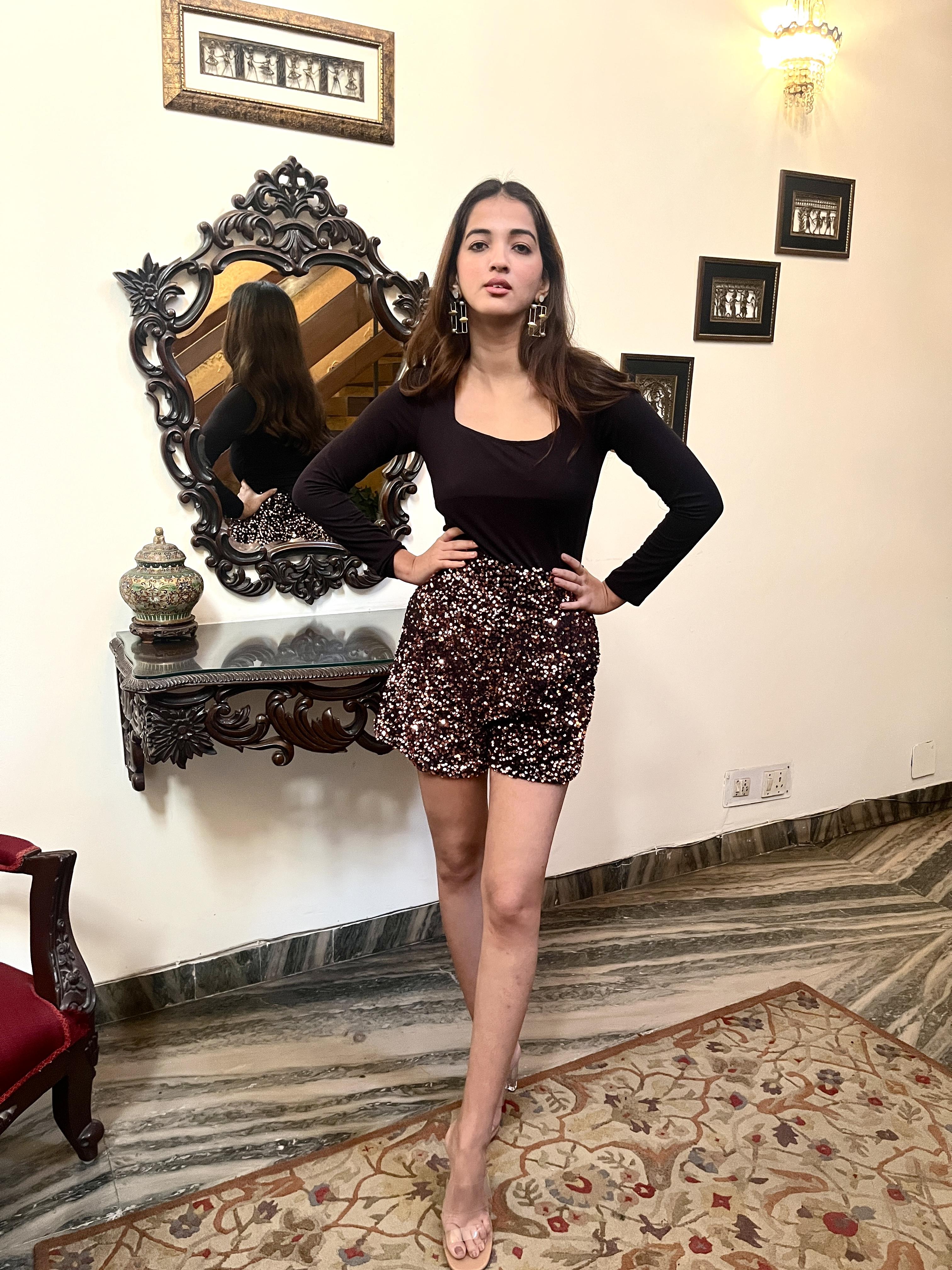 Fitted sequin shorts with a wide-leg silhouette and high-rise waist for a stylish look.