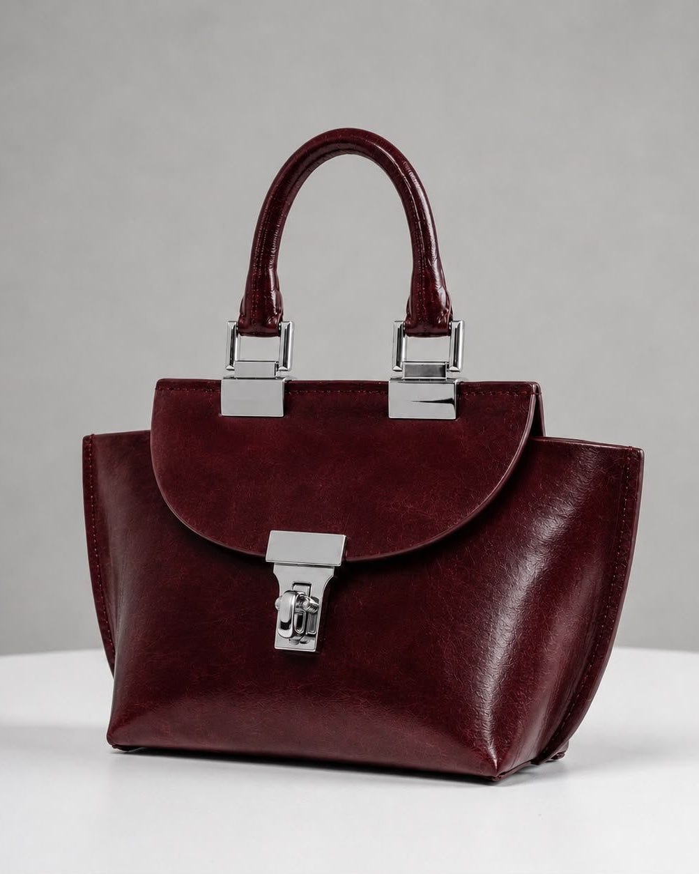 WU HAUS | Le Bon 14 Plum Leather Top Handle Bag