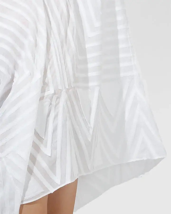 White sheer skirt with geometric striped pattern, modern fashion apparel close-up