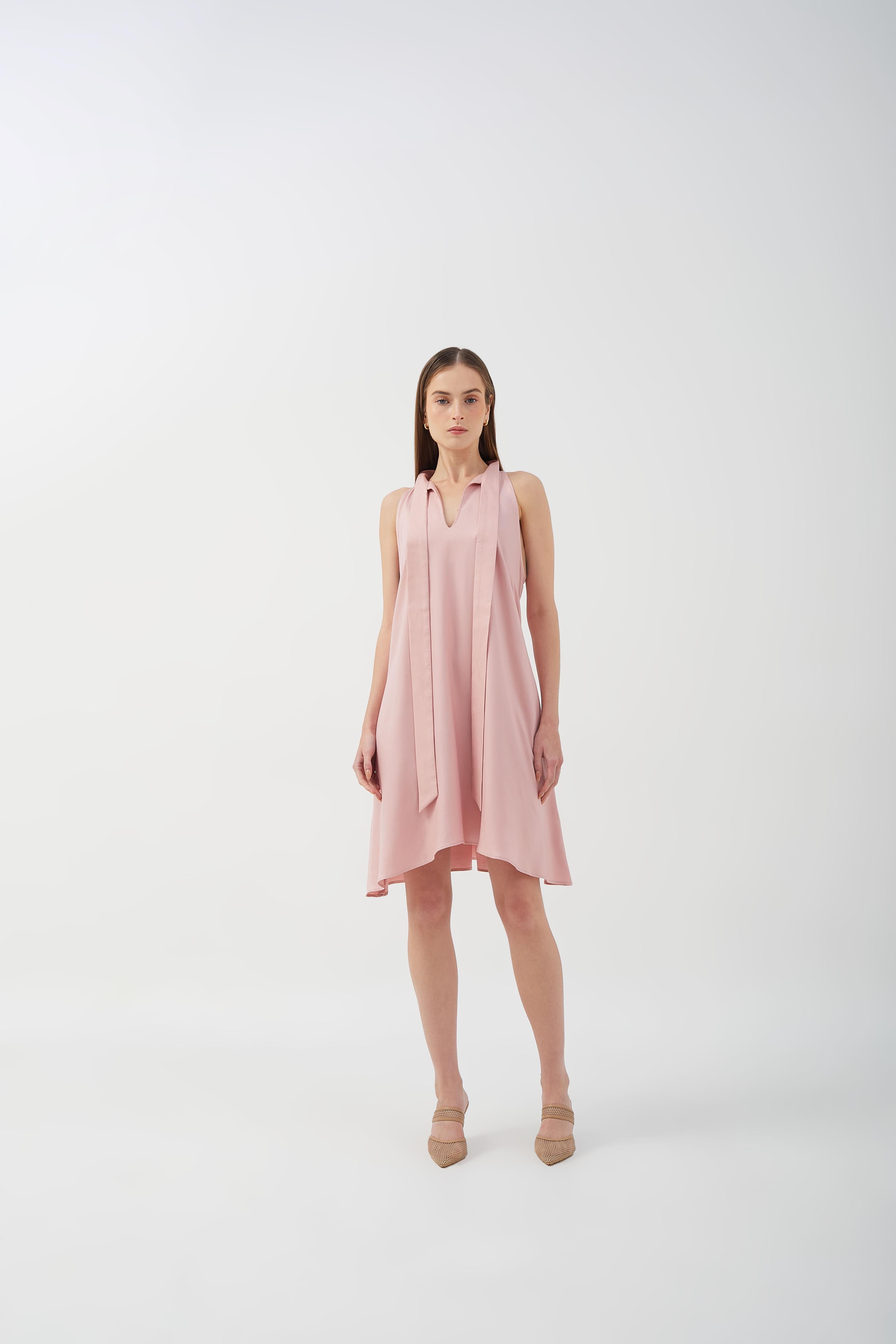 A-line dress with bow tie neck and asymmetrical hem, perfect for casual styling.