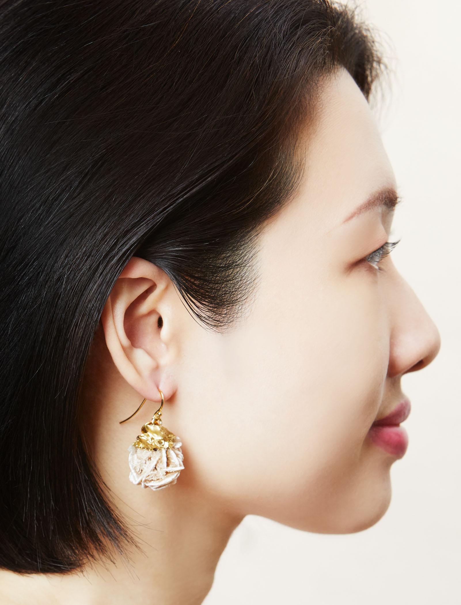 Large natural crystal hook earrings in rose gold.