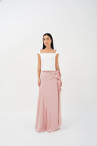 Wrap skirt featuring a relaxed fit and asymmetric cut, ideal for versatile styling.