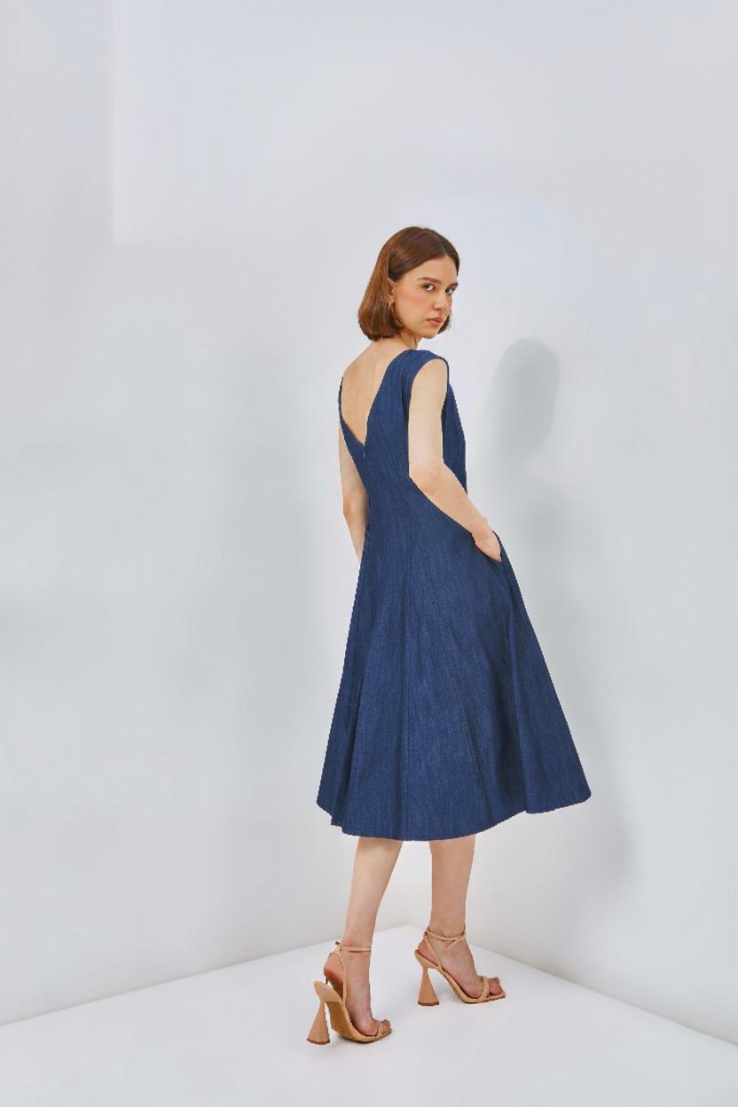 Fit and flare dress in denim with boat neckline and flared skirt, ideal for casual styling.