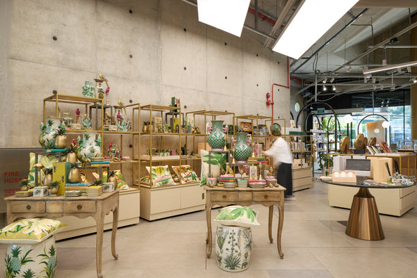 Ceramic vessels, cushions and decorative objects on shelves and tables at DORS