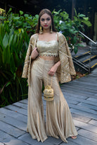 Embroidered jacket with sequins and shoulder pads, featuring a relaxed fit.